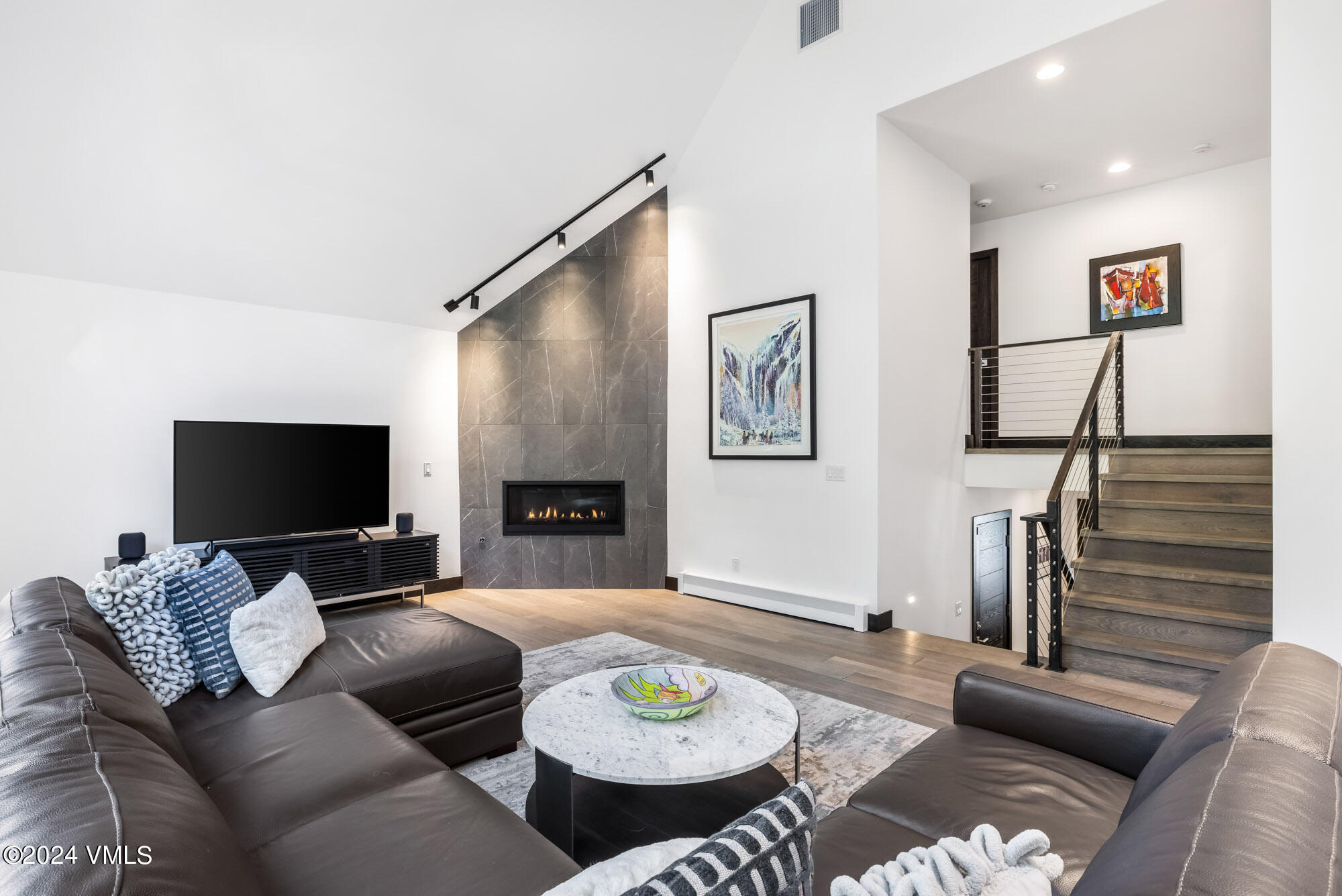 3891 Big Horn Road, Unit C Vail, CO 81657 - Photo 2 of 53 a living room with furniture and a flat screen tv