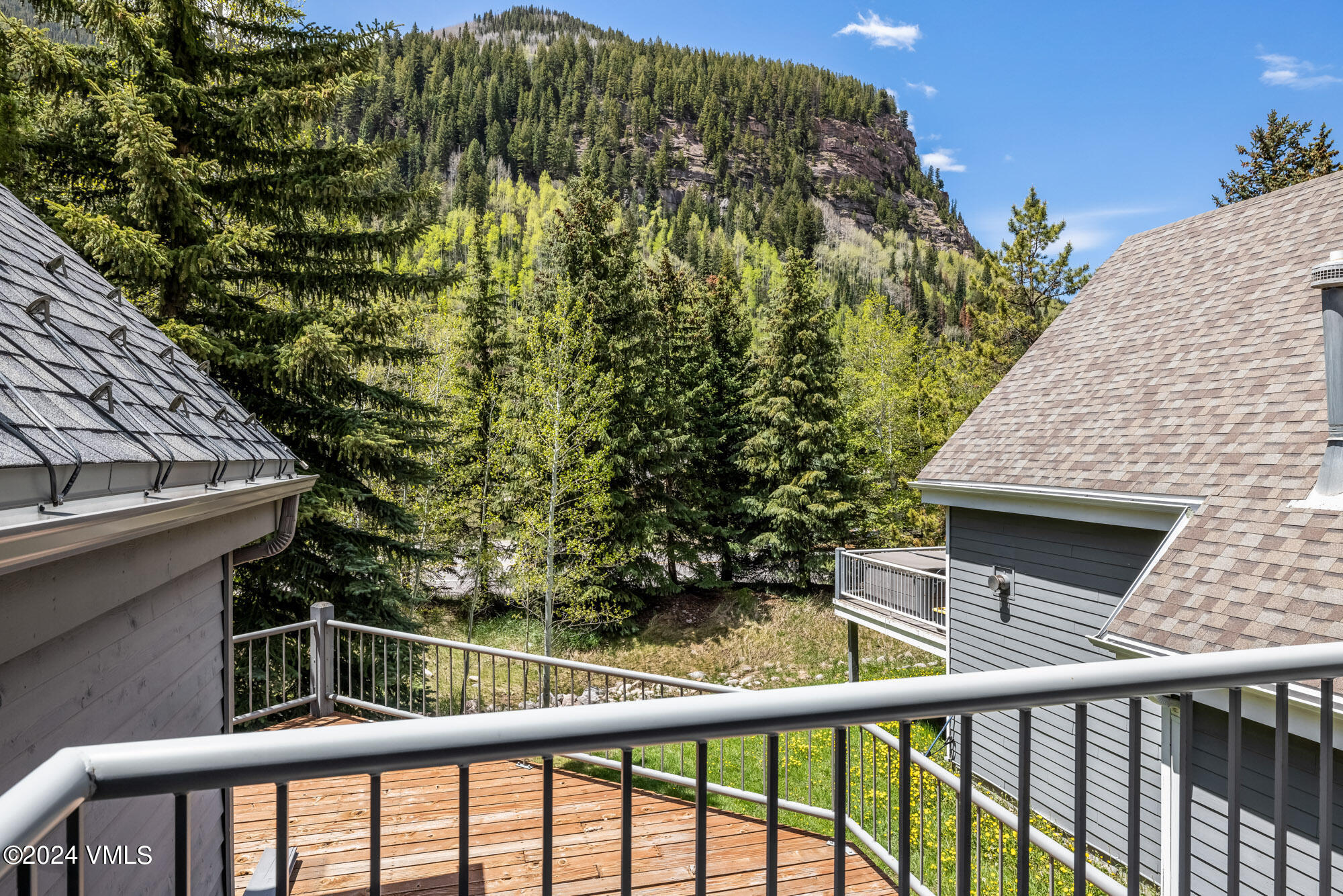 3891 Big Horn Road, Unit C Vail, CO 81657 - Photo 26 of 53 a balcony with trees