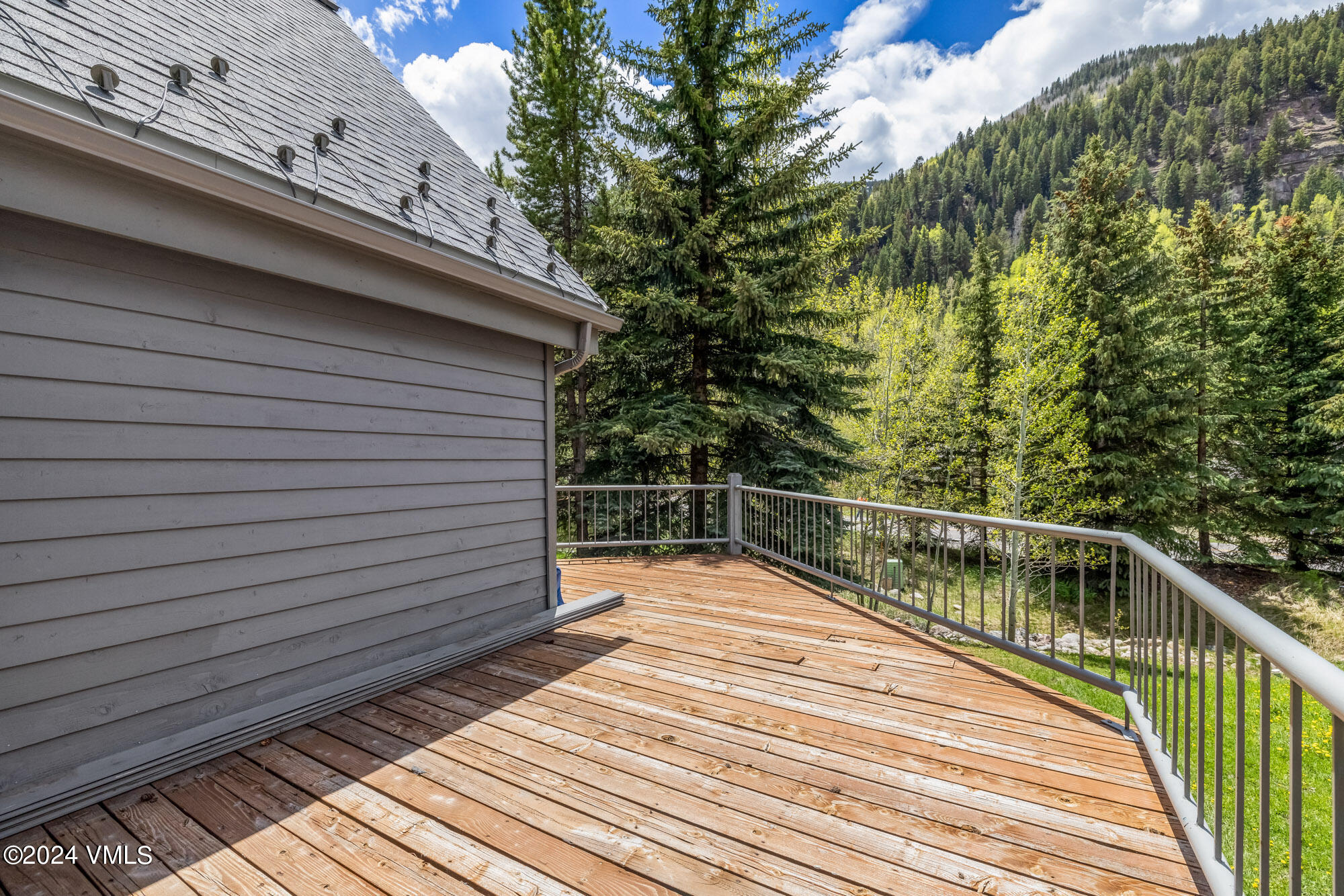 3891 Big Horn Road, Unit C Vail, CO 81657 - Photo 37 of 53 a view of balcony with wooden floor and fence and floor