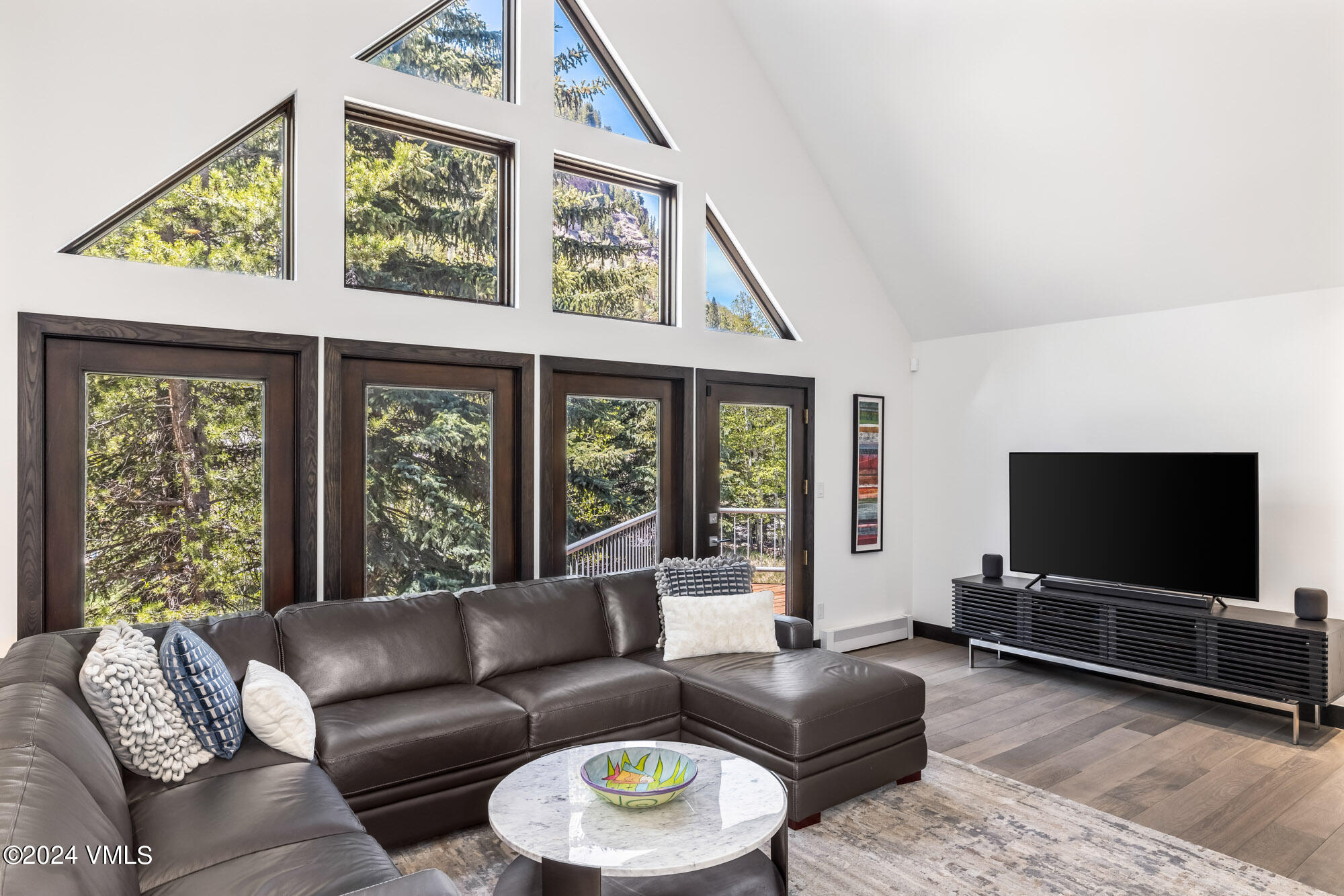 3891 Big Horn Road, Unit C Vail, CO 81657 - Photo 5 of 53 a living room with furniture and a flat screen tv