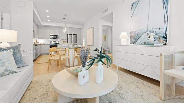 a dining room with furniture and wooden floor