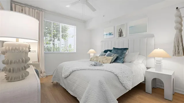 a bedroom with a bed and a table