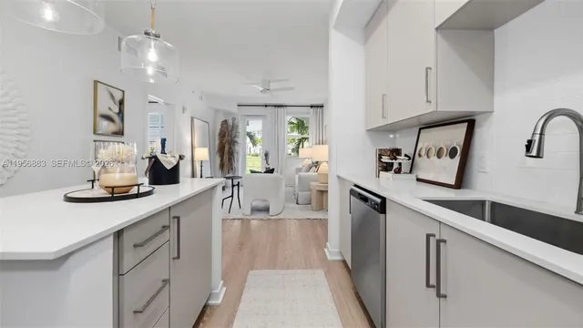 a kitchen with counter top space cabinets and stainless steel appliances