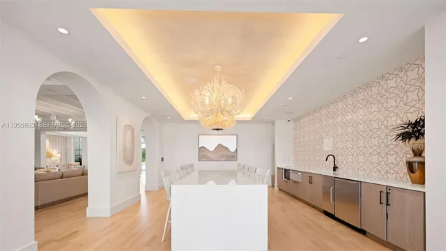 a view of a living room with wooden floor