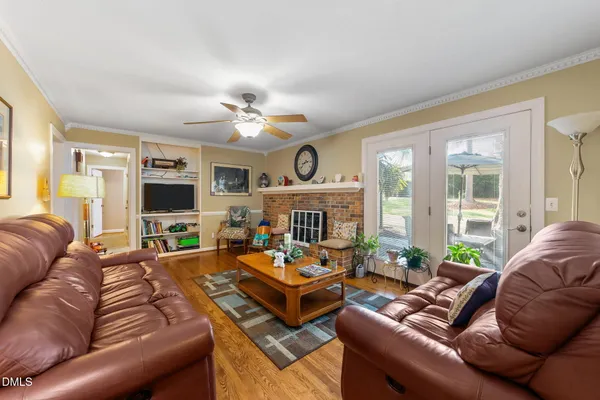 a living room with furniture fireplace and a flat screen tv