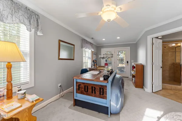 a bedroom with furniture and a window