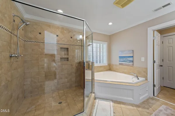 a bathroom with a bathtub and a shower