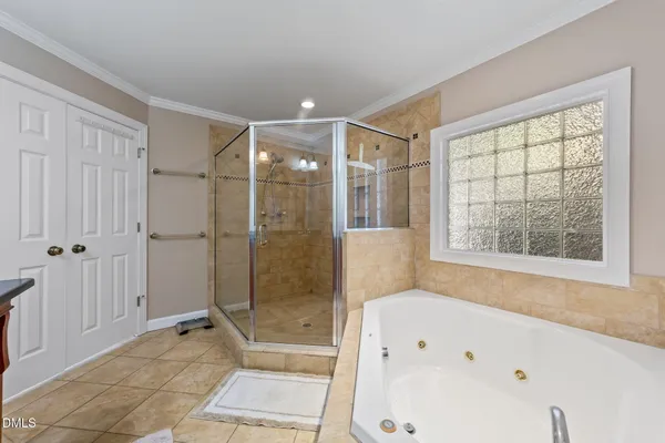 a bathroom with a bathtub and a shower