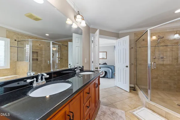 a bathroom with a sink double vanity and a mirror