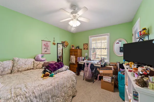 a bedroom with furniture and a window