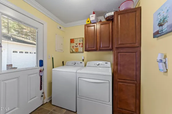 a view of storage and utility room with washer and dryer