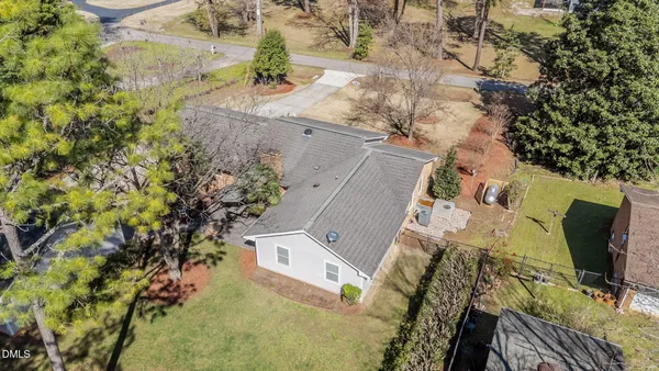 an aerial view of a house with outdoor space