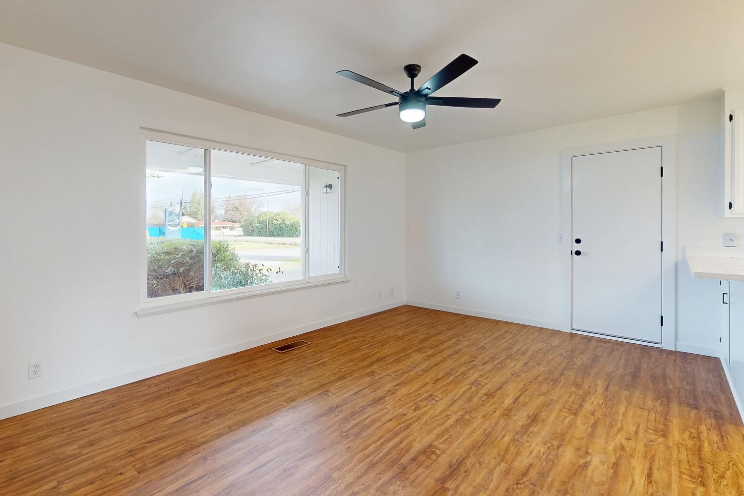 7830 Griffith Lane Sutter, CA 95982 - Photo 19 of 69 a view of empty room with wooden floor and window