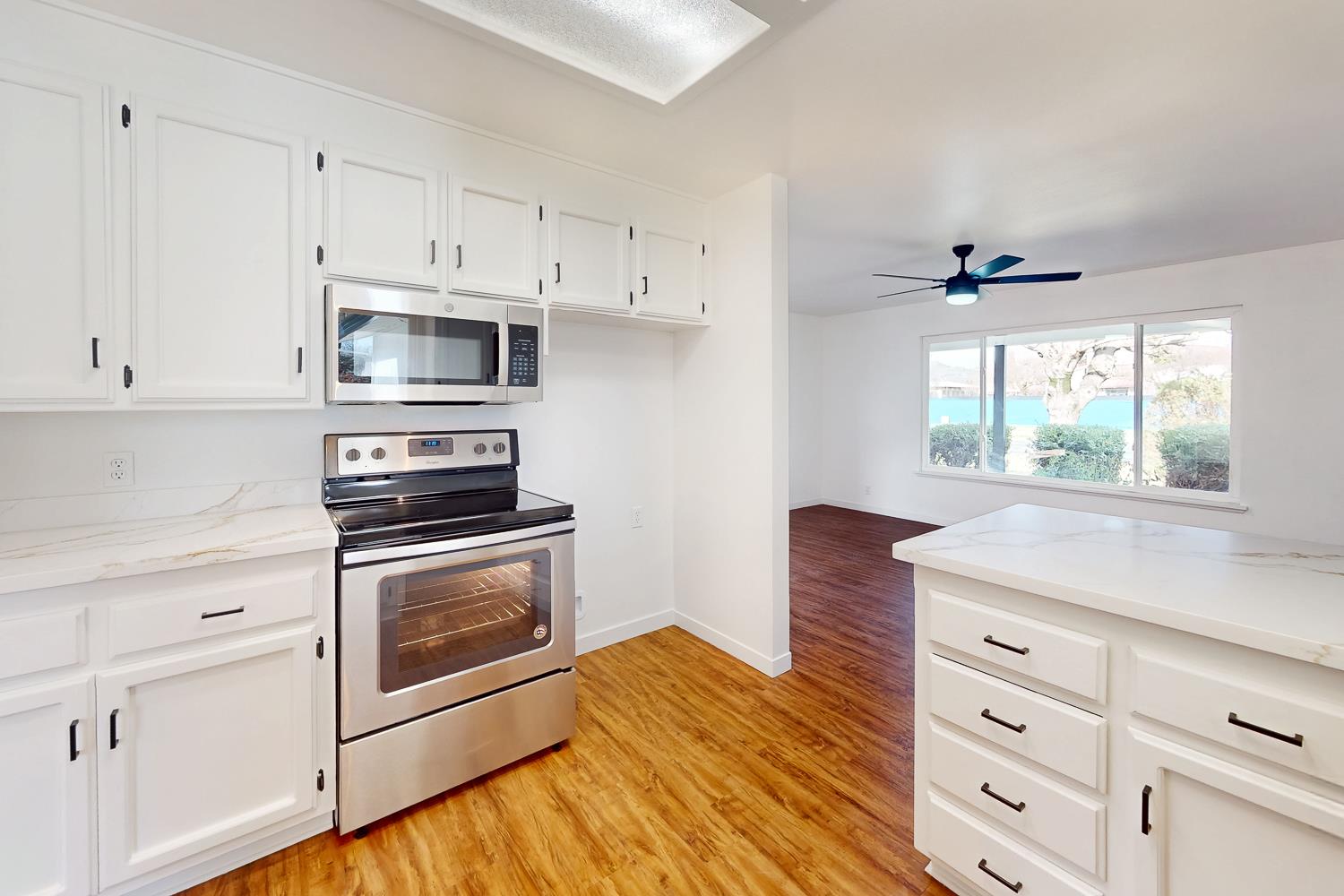 7830 Griffith Lane Sutter, CA 95982 - Photo 29 of 69 a kitchen with cabinets appliances and a window