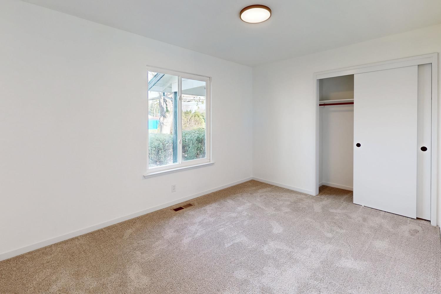 7830 Griffith Lane Sutter, CA 95982 - Photo 30 of 69 an empty room with windows and closet