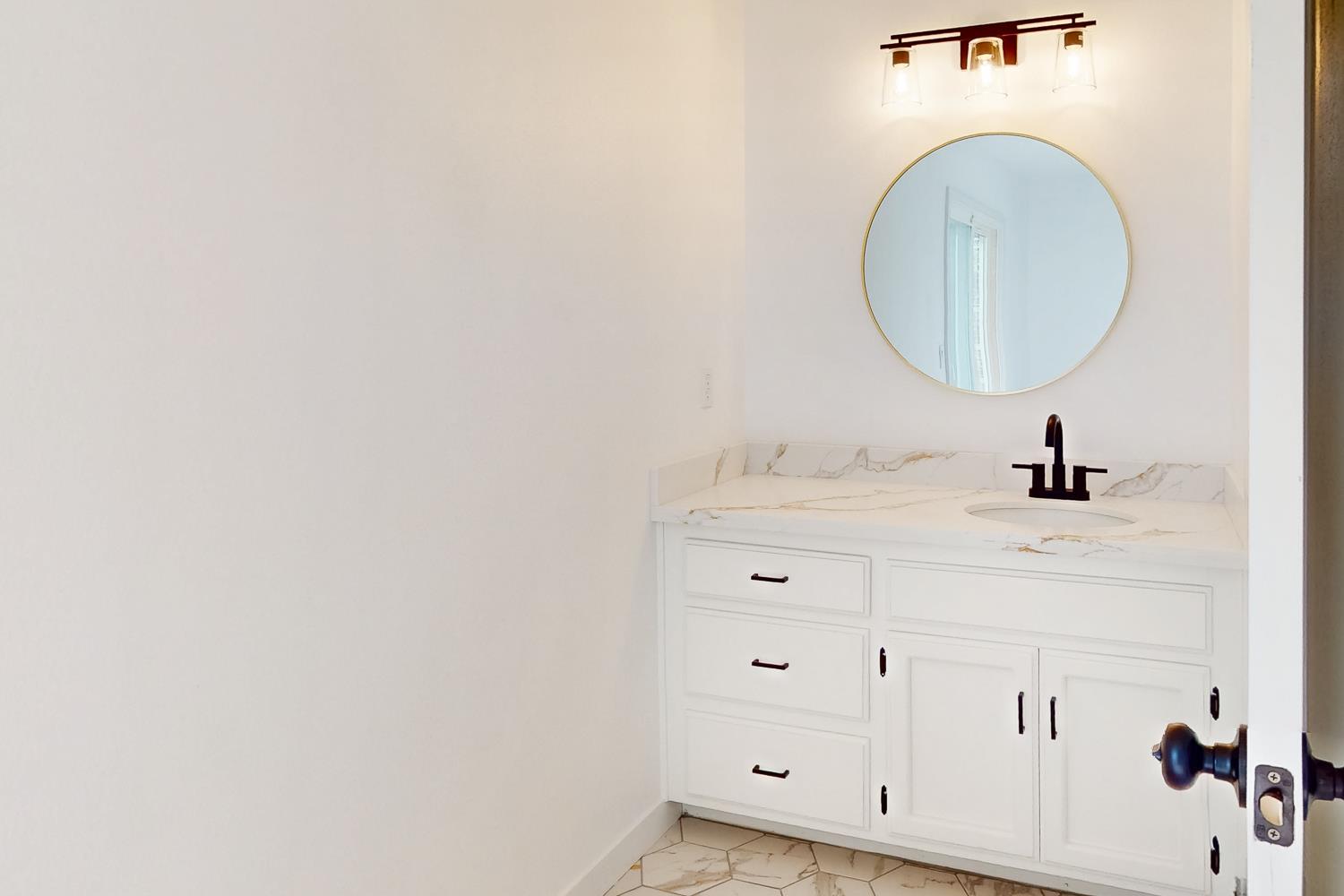 7830 Griffith Lane Sutter, CA 95982 - Photo 39 of 69 a bathroom with a sink and a mirror
