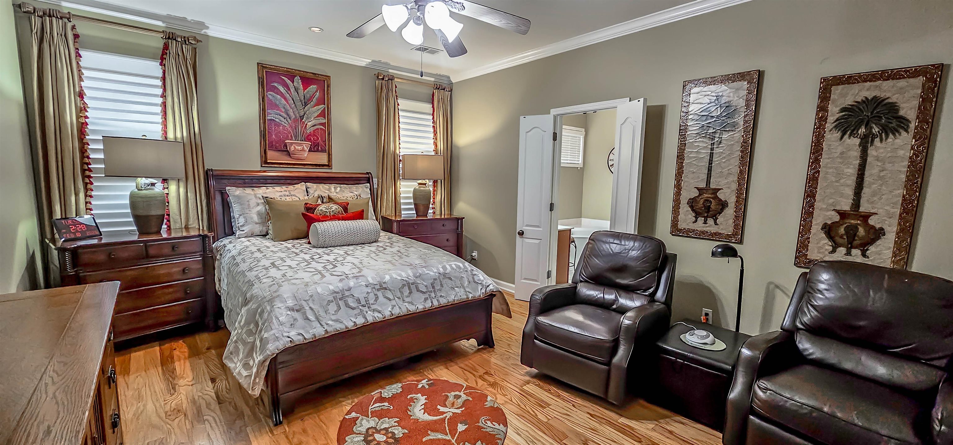 824 McFerrin Lane Collierville, TN 38017 - Photo 12 of 25 Bedroom featuring wood finished floors, crown molding, ceiling fan, and ensuite bath