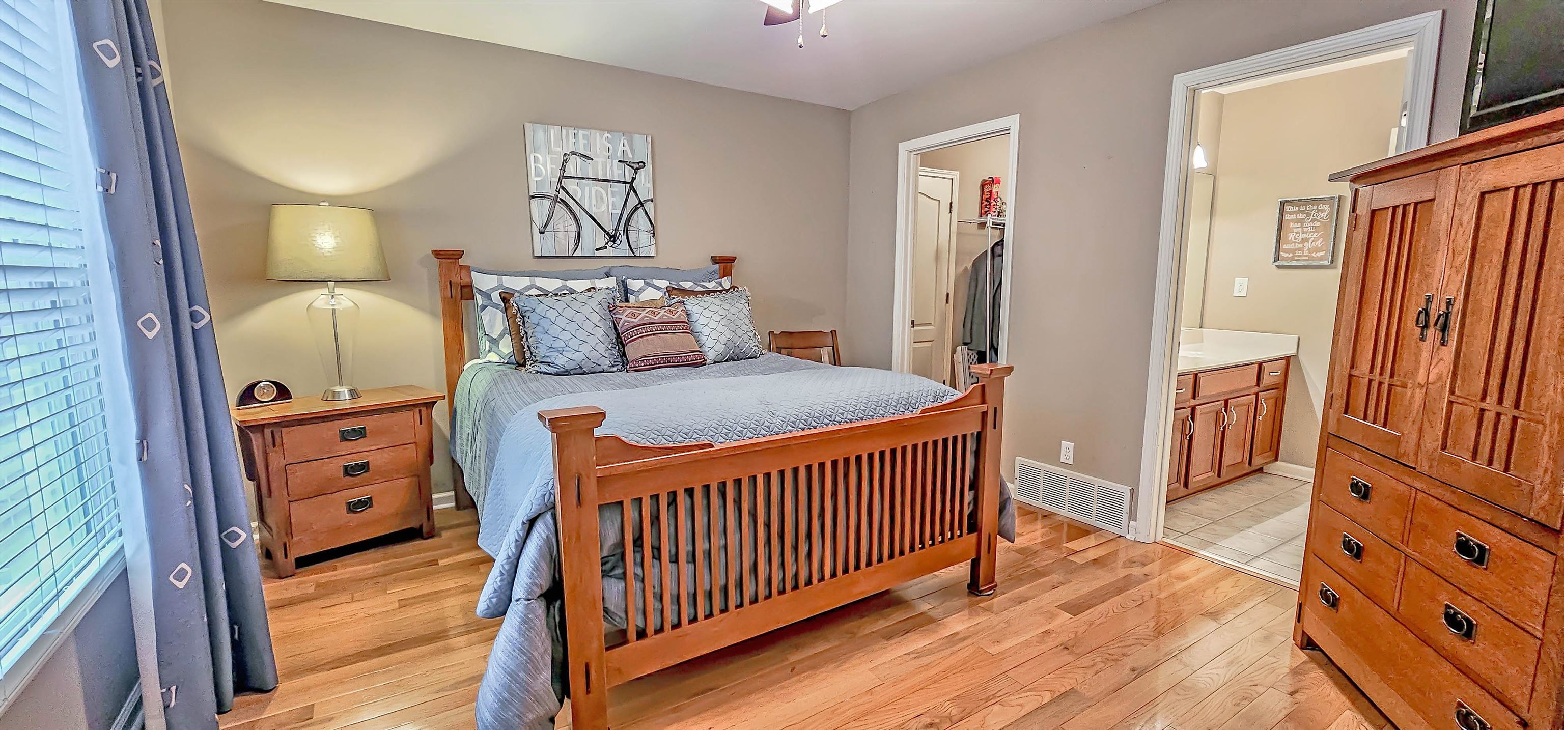 824 McFerrin Lane Collierville, TN 38017 - Photo 18 of 25 Bedroom featuring light wood-style floors and connected bathroom