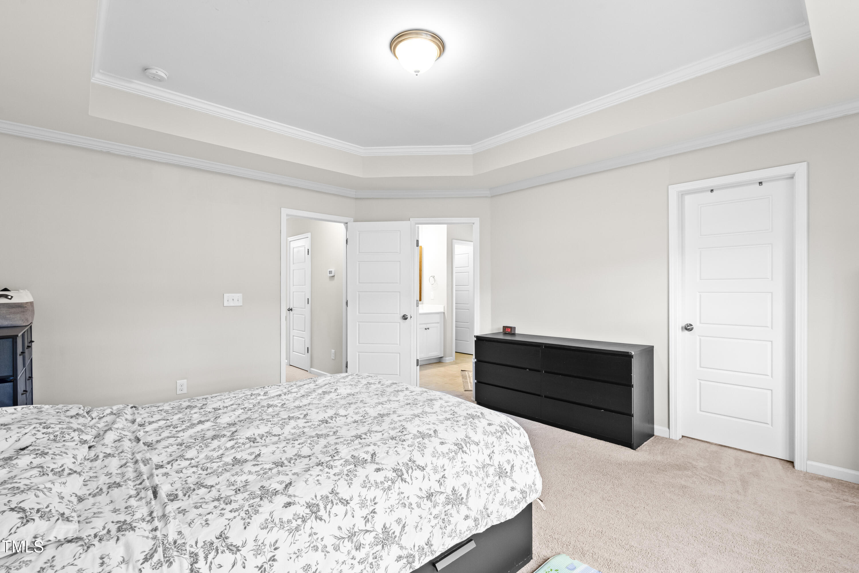 1004 Metropolitan Drive Durham, NC 27713 - Photo 10 of 28 a bedroom with a bed and a dresser