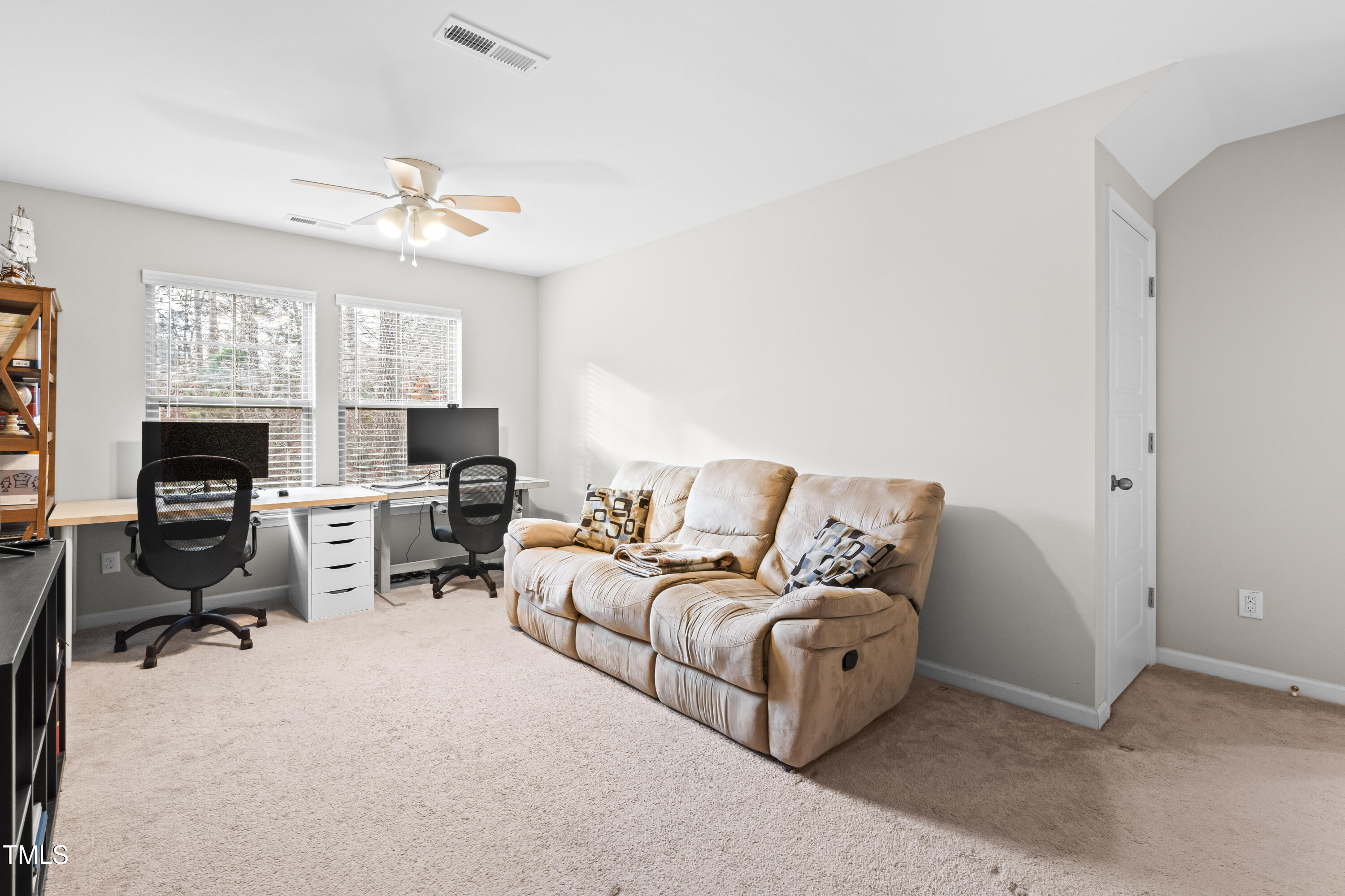 1004 Metropolitan Drive Durham, NC 27713 - Photo 17 of 28 a living room with furniture a fireplace and a chandelier