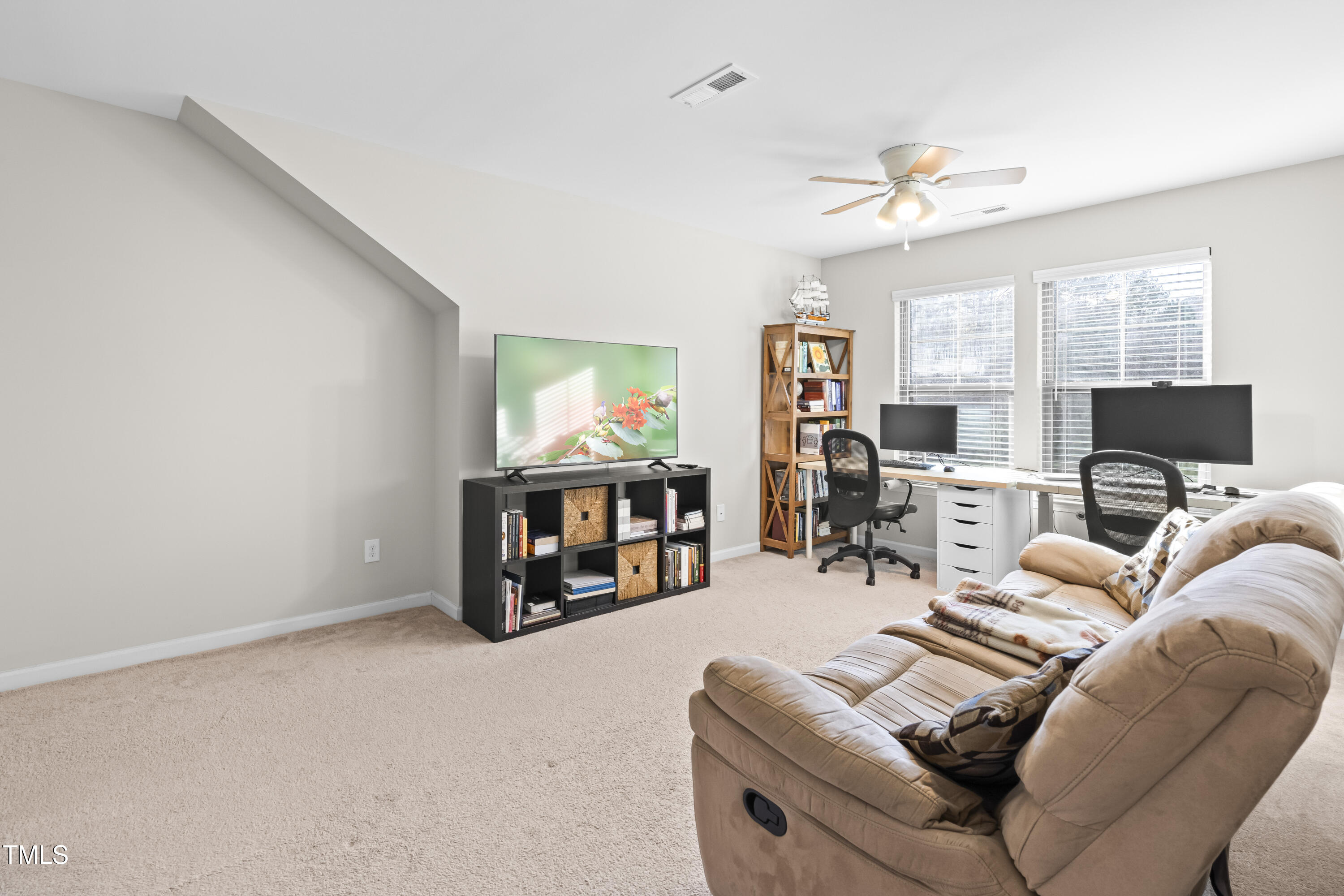 1004 Metropolitan Drive Durham, NC 27713 - Photo 18 of 28 a living room with furniture and a flat screen tv