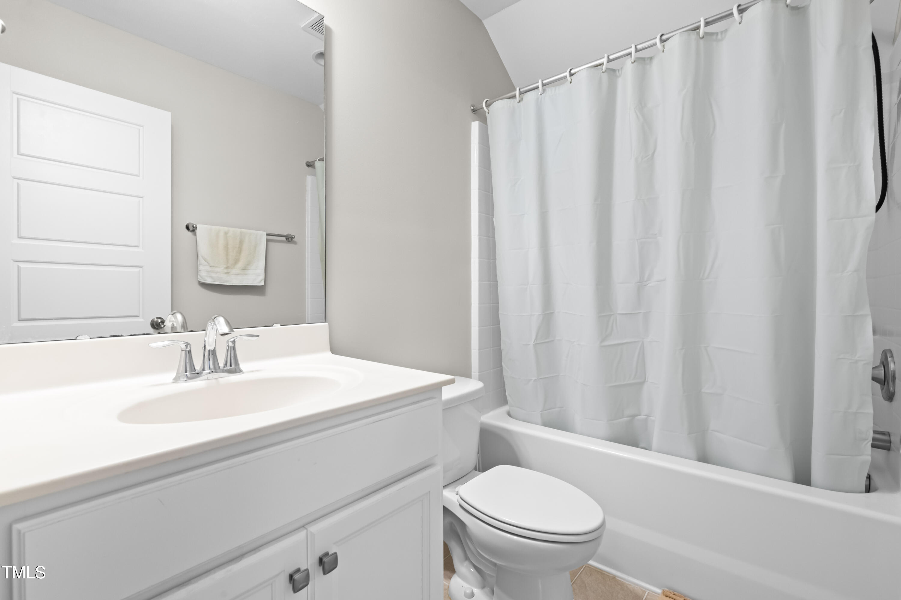 1004 Metropolitan Drive Durham, NC 27713 - Photo 19 of 28 a bathroom with a sink a toilet and shower curtain