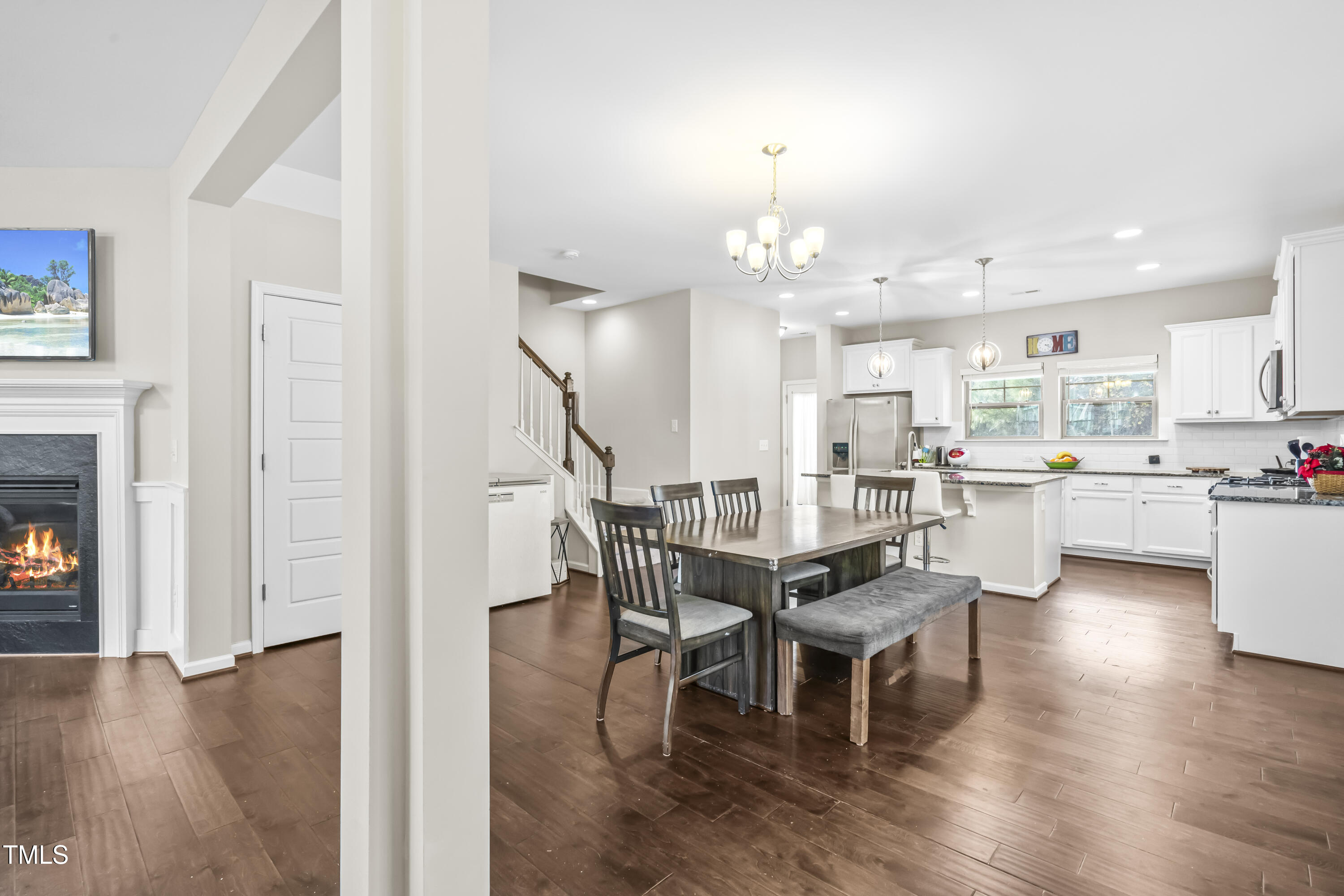 1004 Metropolitan Drive Durham, NC 27713 - Photo 3 of 28 a view of a dining room with furniture and wooden floor