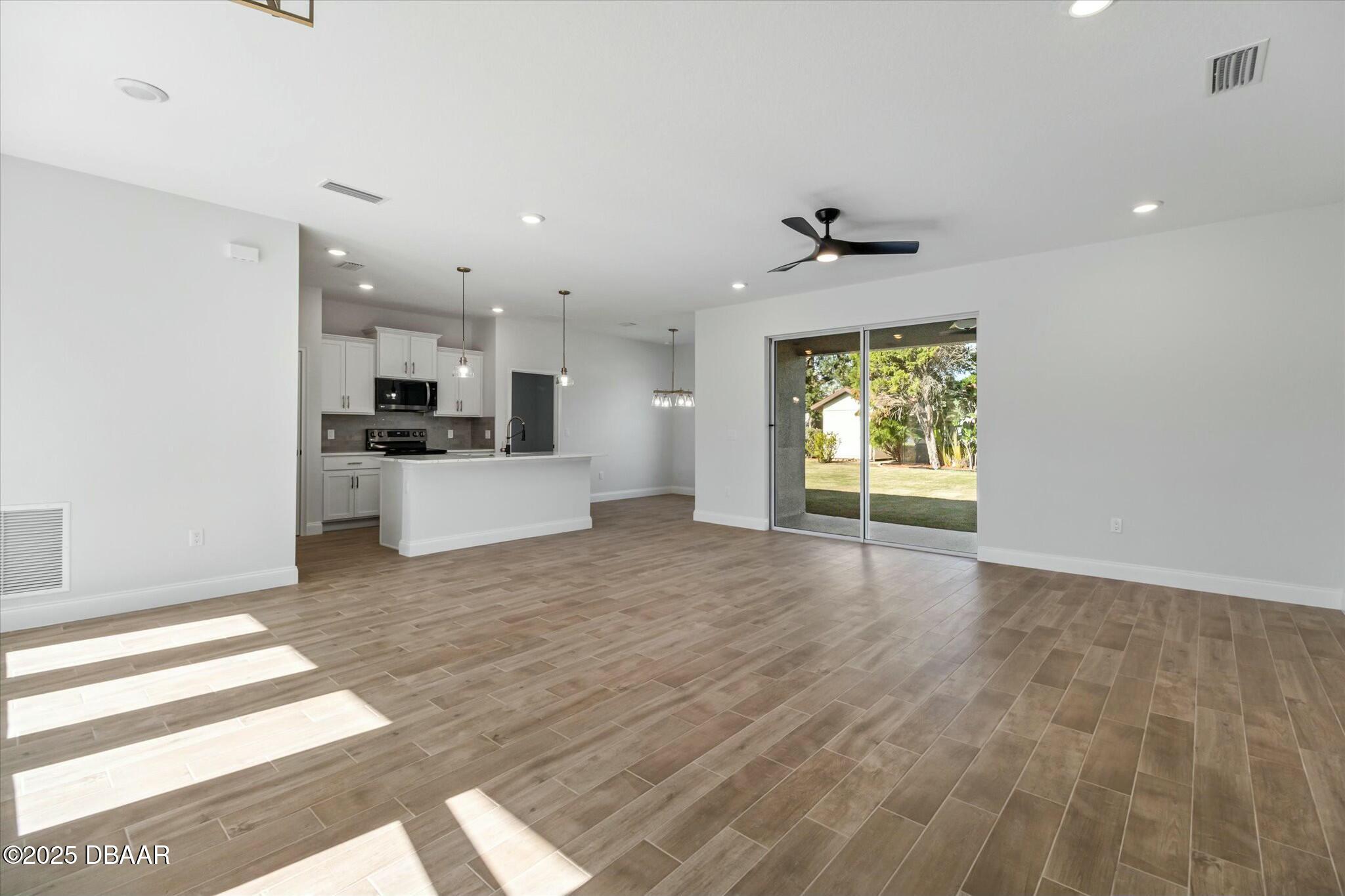 2 Seamanship Trail Palm Coast, FL 32164 - Photo 11 of 38 a view of a kitchen with a sink and a window
