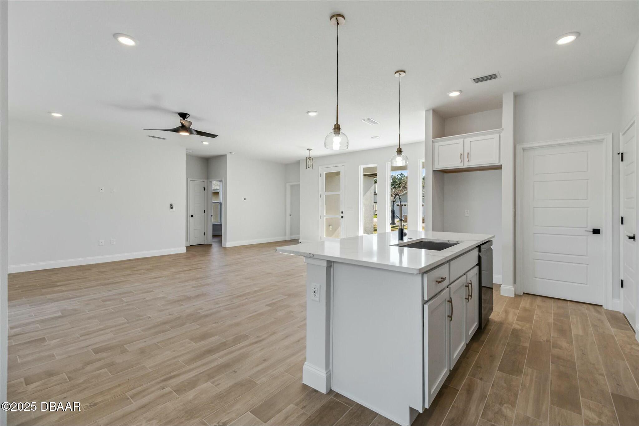 2 Seamanship Trail Palm Coast, FL 32164 - Photo 12 of 38 a kitchen with stainless steel appliances granite countertop a sink stove and refrigerator