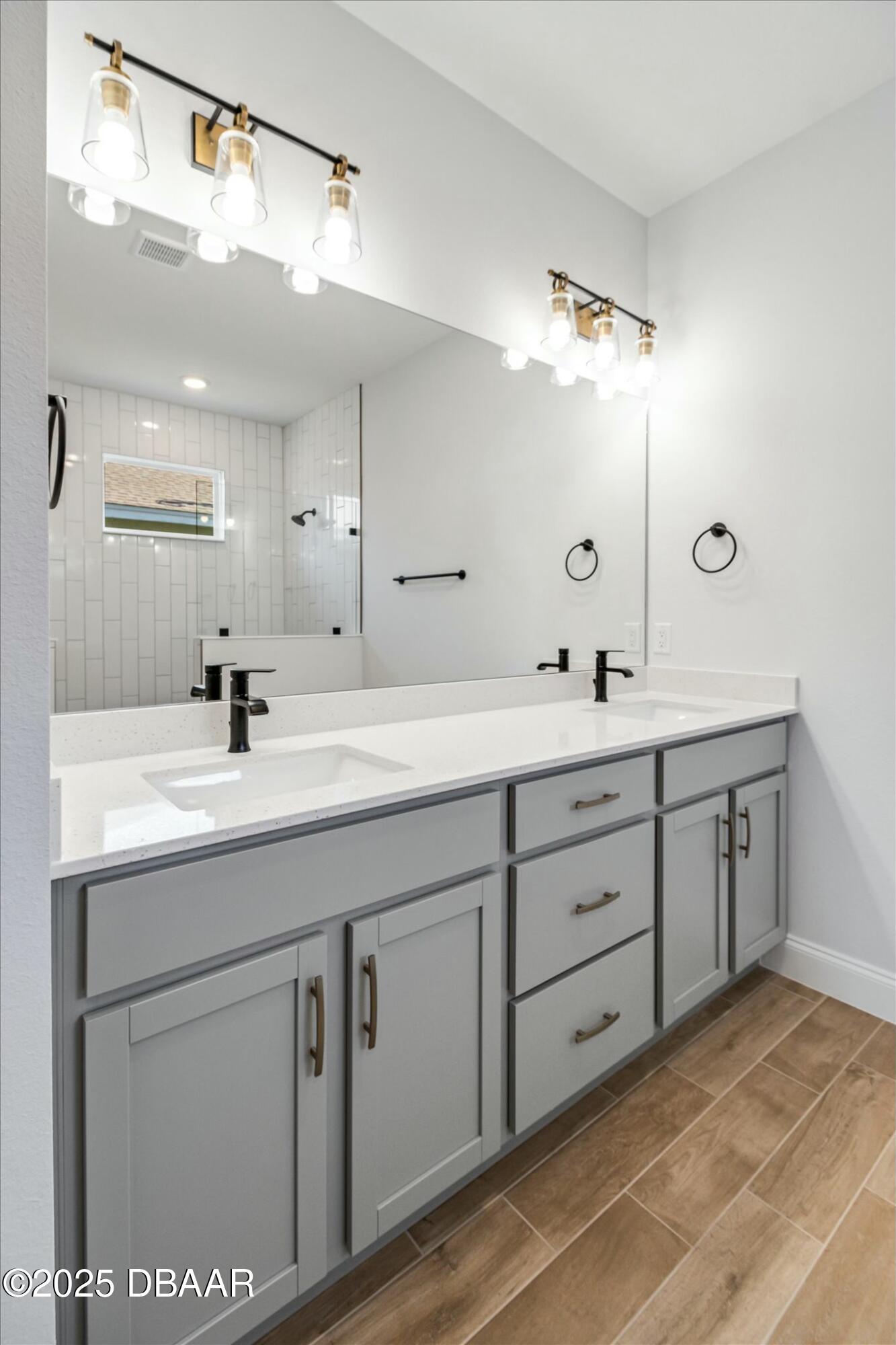 2 Seamanship Trail Palm Coast, FL 32164 - Photo 25 of 38 a bathroom with a double vanity sink and mirror