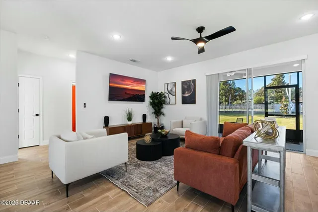 a living room with furniture and a large window