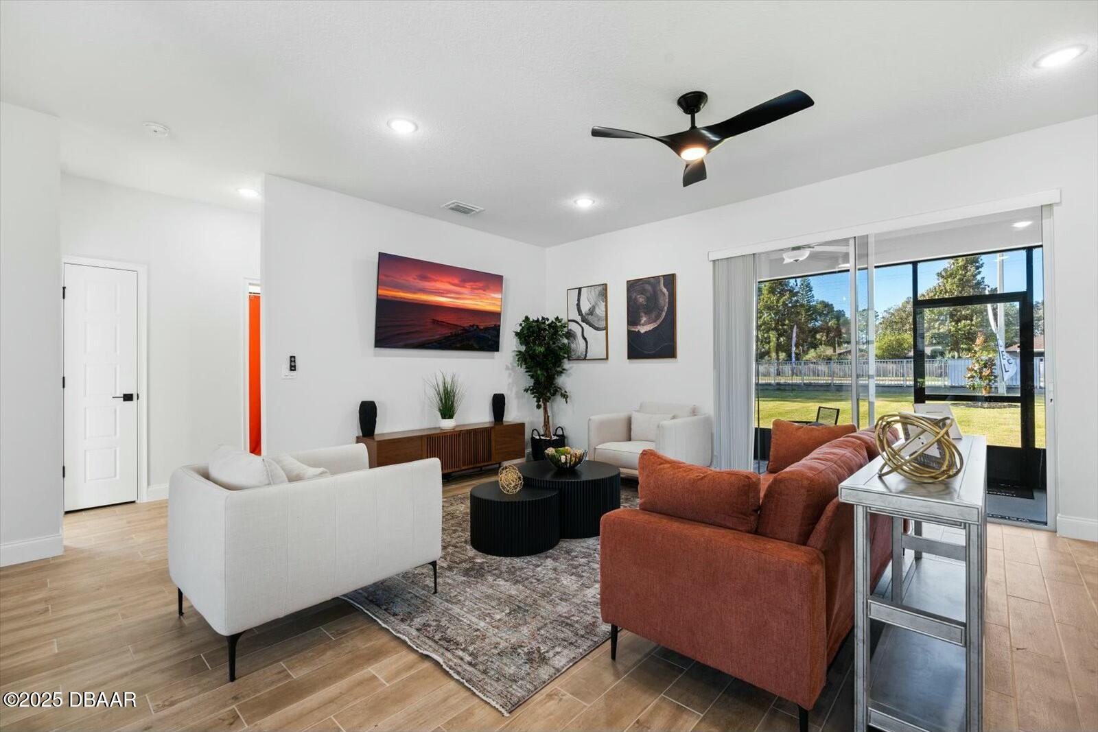 2 Seamanship Trail Palm Coast, FL 32164 - Photo 32 of 38 a living room with furniture and a large window