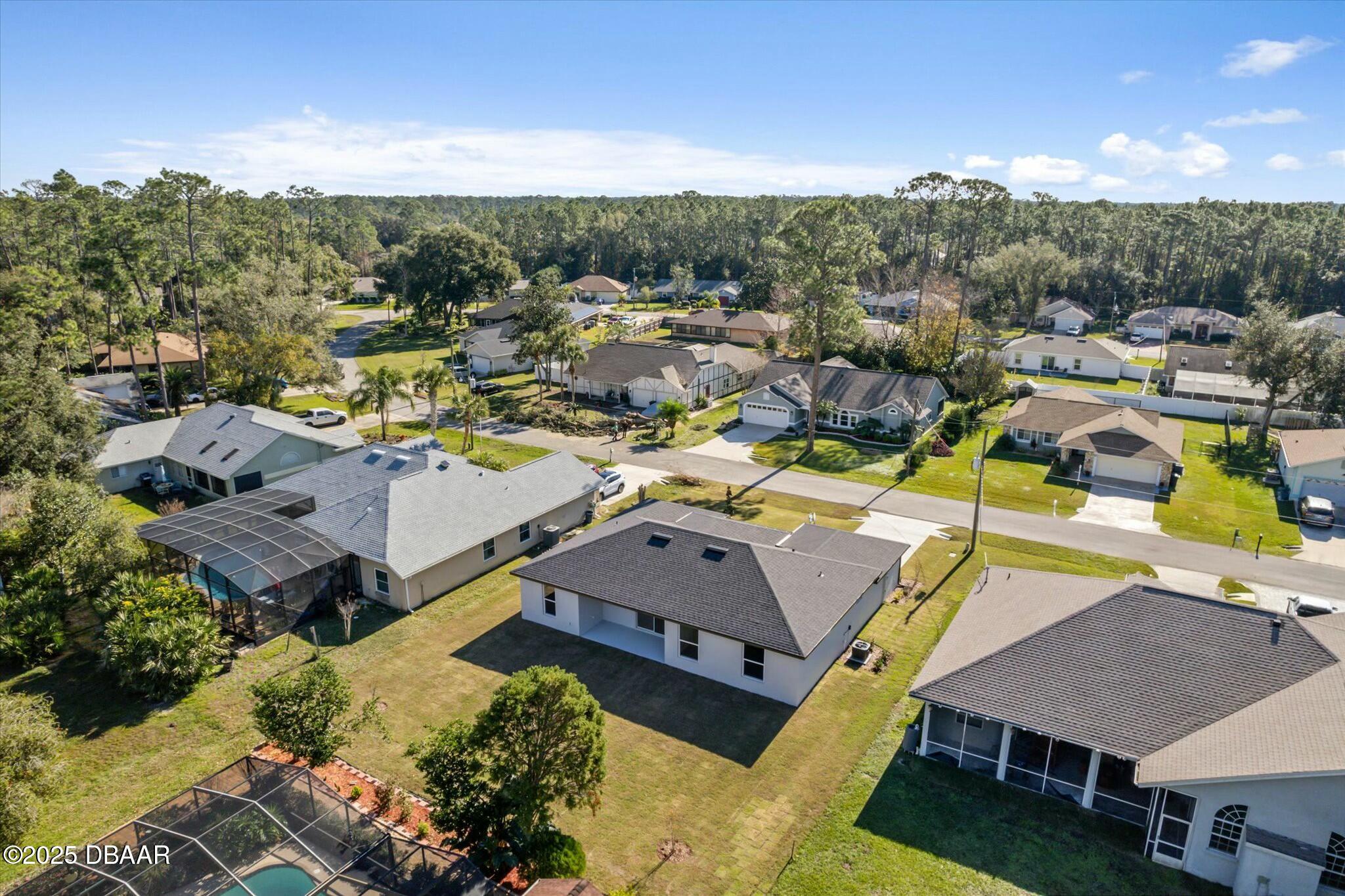 2 Seamanship Trail Palm Coast, FL 32164 - Photo 5 of 38 a view of a houses with a swimming pool