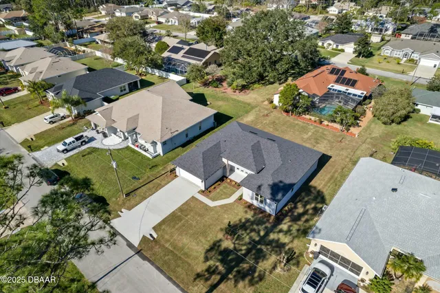 an aerial view of a house with a garden