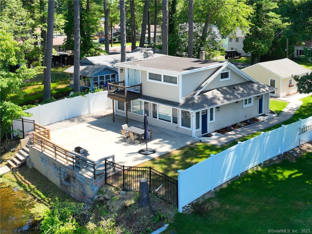 79 Cottage Road Enfield, CT 06082 - Photo 1 of 1 a view of a house with backyard porch and sitting area