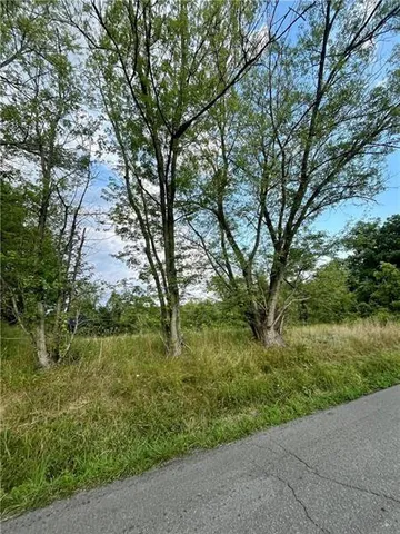 a view of a lake with a big yard