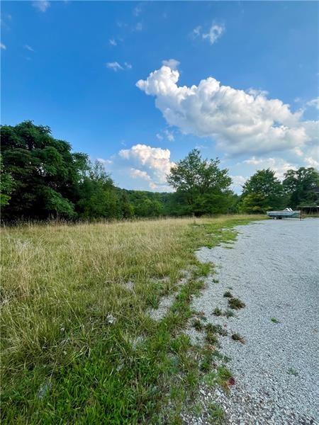 1054 Eldersville Road Burgettstown, PA 15021 - Photo 5 of 8 a view of a lake with a big yard