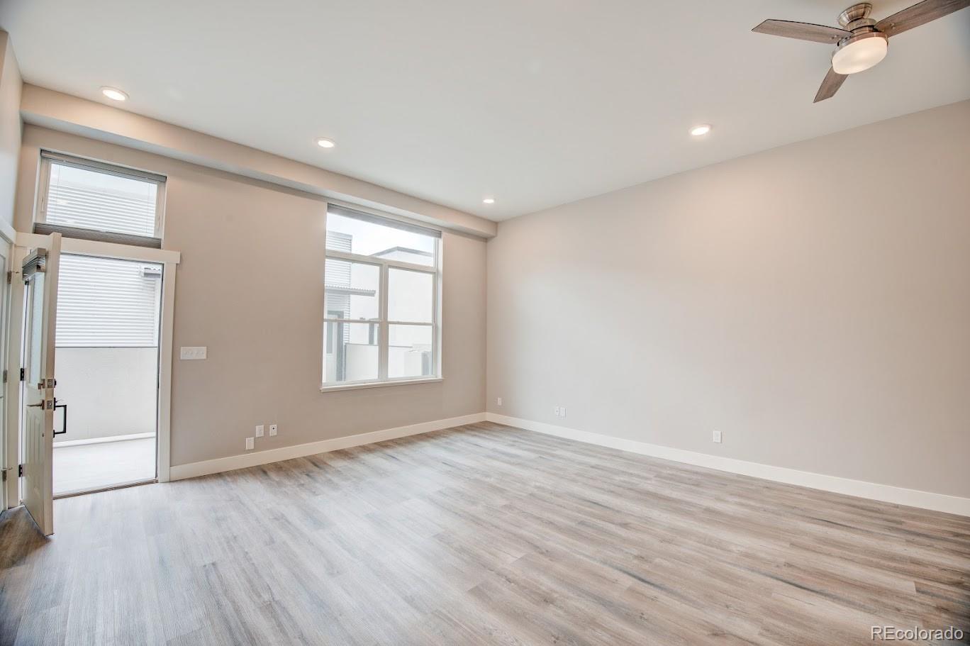 114 Old Stage Road, Unit B Salida, CO 81201 - Photo 7 of 22 wooden floor in an empty room with a window