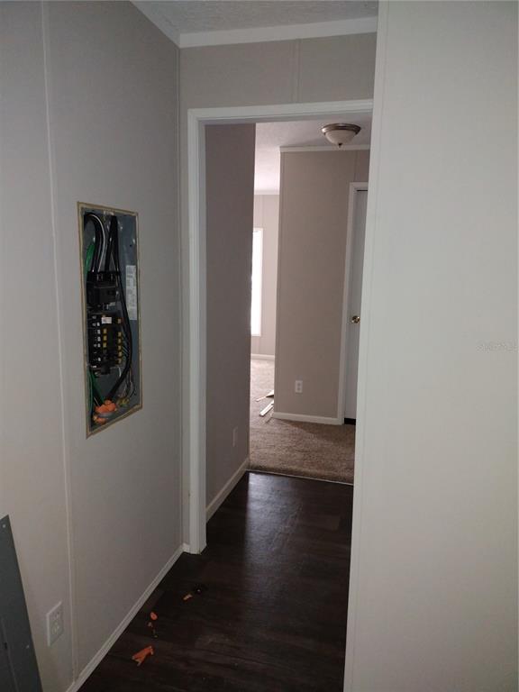 13144 Southwest 18th Street Road Ocala, FL 34481 - Photo 12 of 20 an empty room with wooden floor and closet