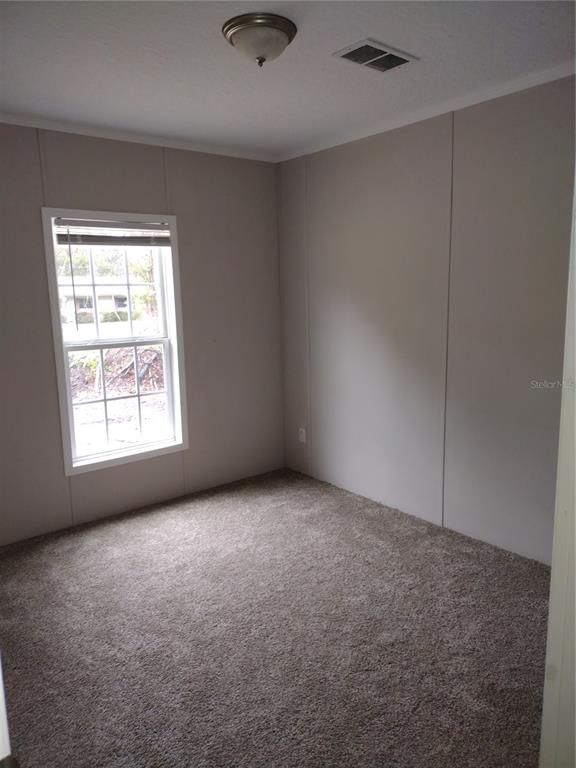 13144 Southwest 18th Street Road Ocala, FL 34481 - Photo 13 of 20 an empty room with windows