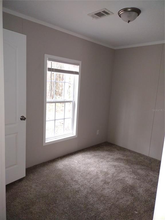 13144 Southwest 18th Street Road Ocala, FL 34481 - Photo 14 of 20 an empty room with a window