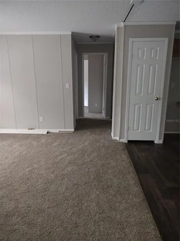 a view of room with wooden floor