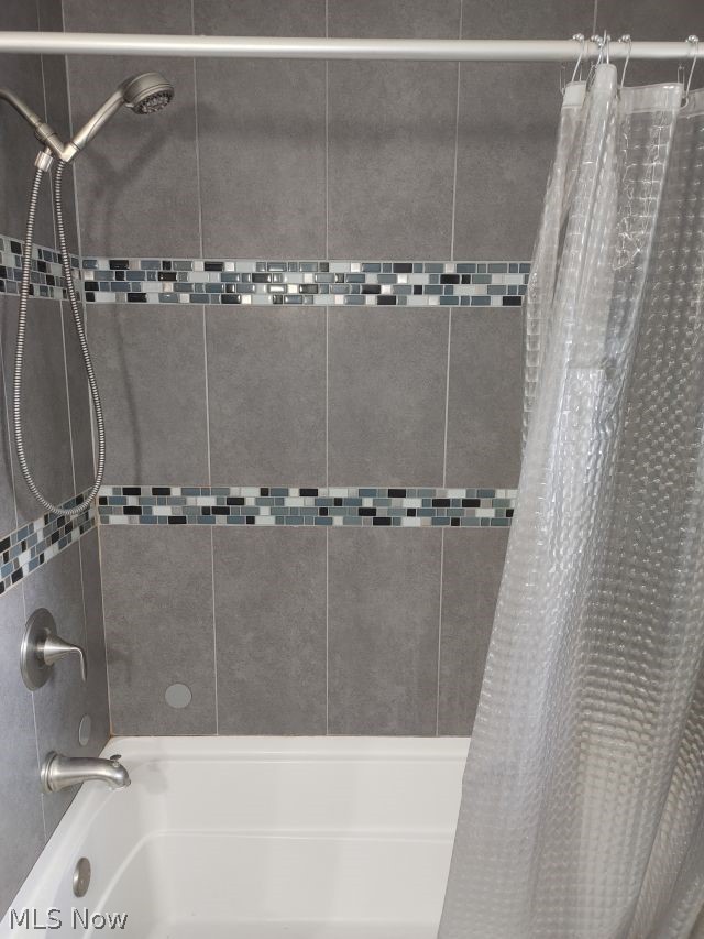 2211 Devonshire Road Northwest Canton, OH 44708 - Photo 27 of 36 Bathroom featuring shower / bath combo with shower curtain