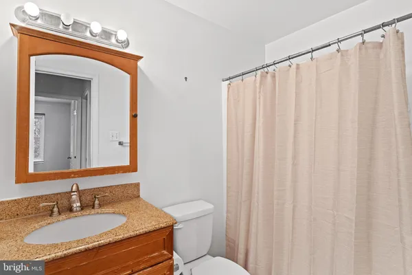 a bathroom with a shower and a bath tub