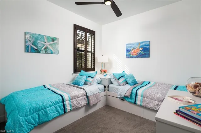 a bathroom with a double vanity sink mirror and shower