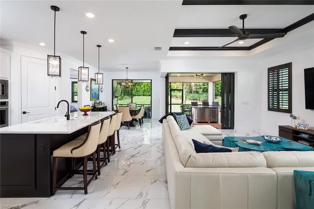 a large kitchen with a large window and table