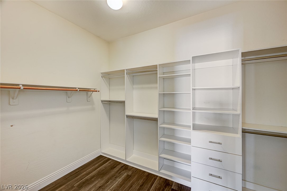 8197 Riley Love Street Las Vegas, NV 89139 - Photo 32 of 48 Customizable storage solutions define this practical walk-in closet.