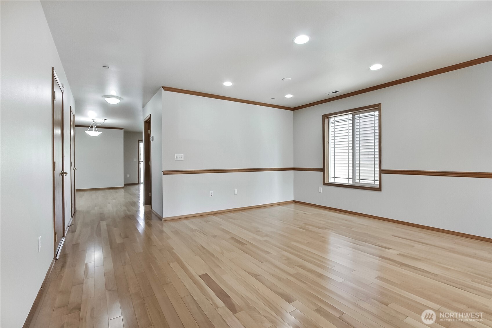 3157 Walker Road DuPont, WA 98327 - Photo 5 of 27 a view of an empty room with wooden floor and a window