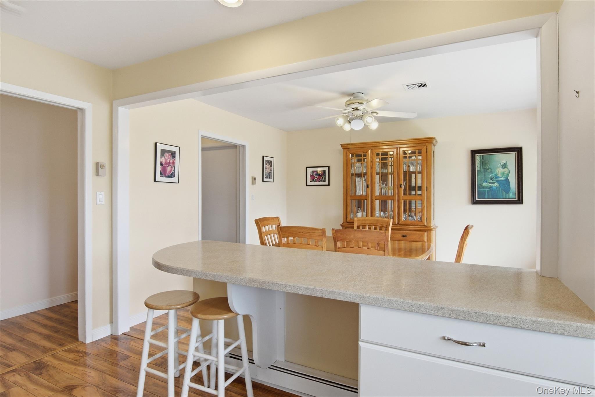 150 Eastbourne Court, Unit B Ridge, NY 11961 - Photo 8 of 33 island with seating