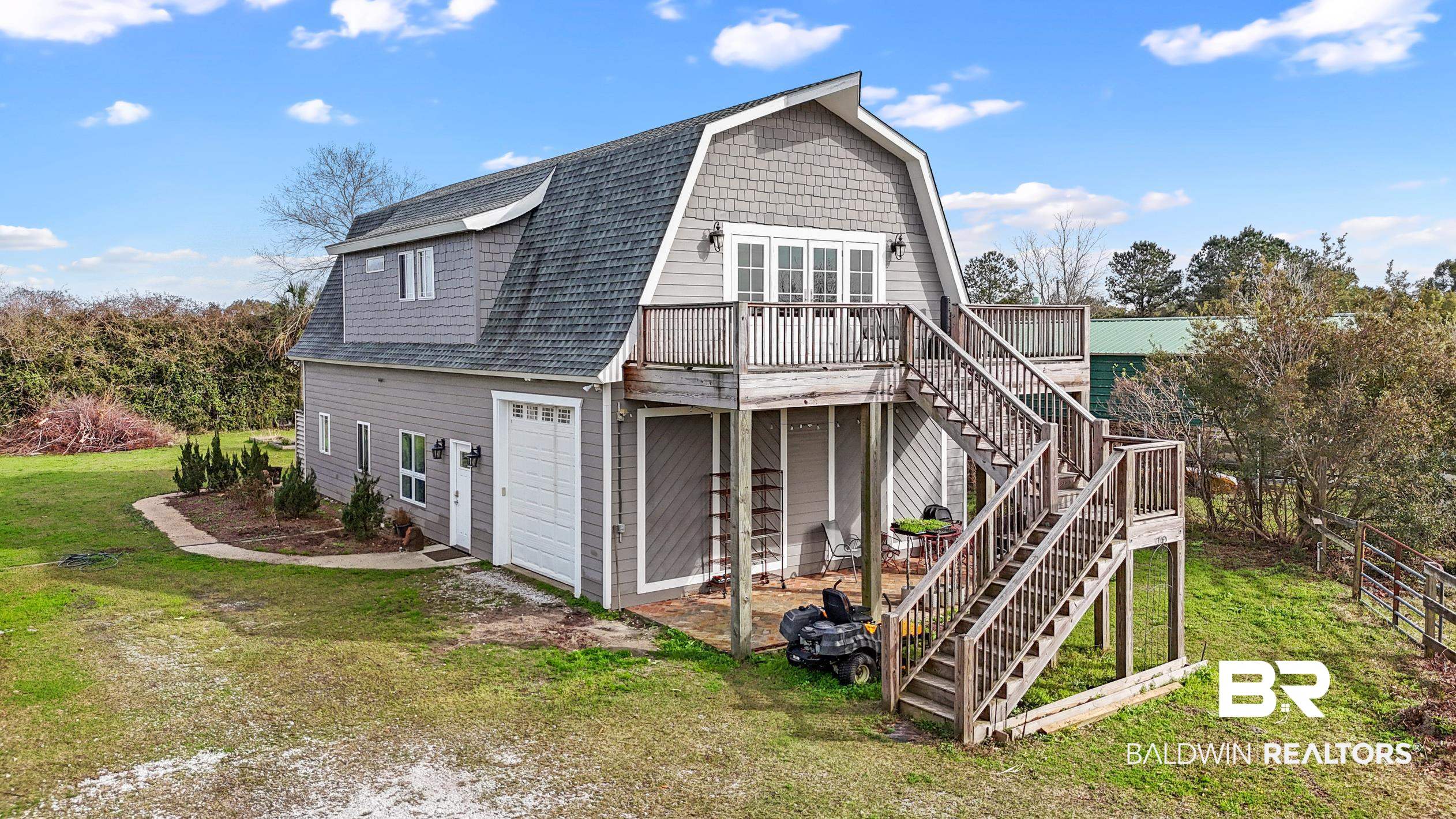 13358 County Road 91 Elberta, AL 36530 - Photo 2 of 47 Rear view of property featuring a wooden deck, a garage, and a lawn